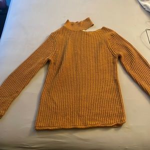 Mustard yellow sweater with left side shoulder peep hole.